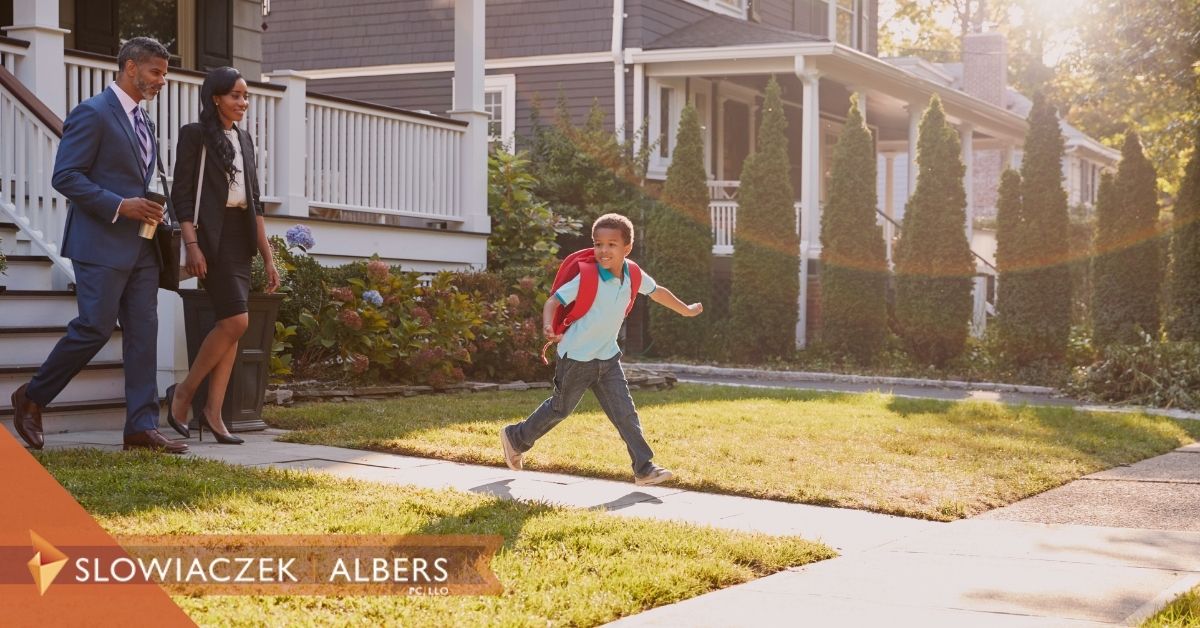 Child running in front of parents.