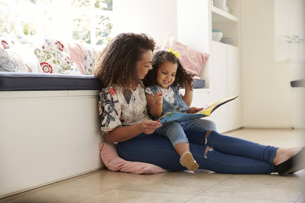 mother reading with daughter